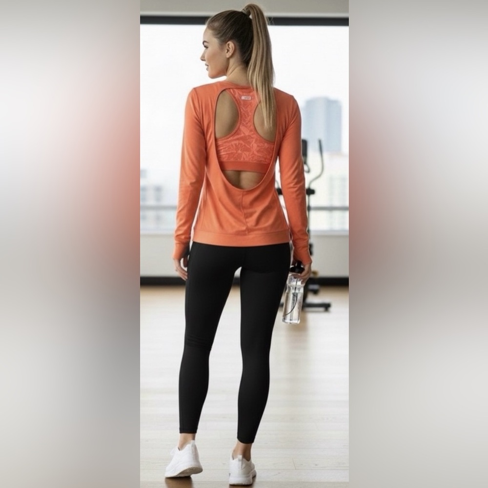 Lucy orange long sleeve workout top, attached bra, deep back cut, small